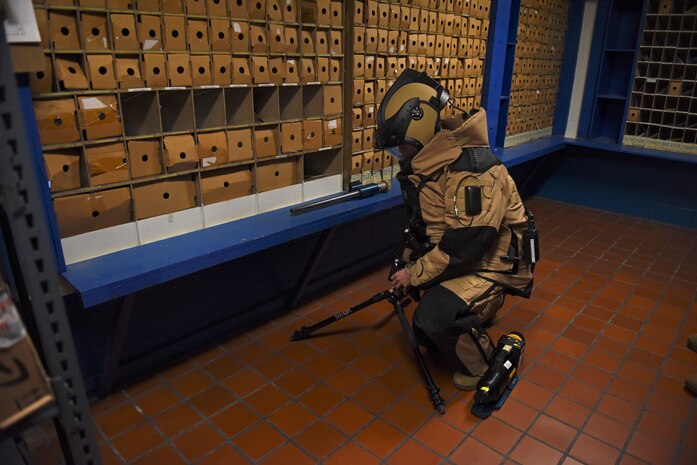 Staff Sgt. Tyler McMillan Wammack, 8th Civil Engineer Squadron Explosive Ordnance Disposal technician, prepares to capture x-rays of the simulated improvised explosive device at the base post office during a training event at Kunsan Air Base, Republic of Korea, April 8, 2020. Technicians learn to use robots, x-ray equipment, bomb suits and specialized EOD tools and techniques to disable IEDs in the field. (U.S. Air Force photo by Staff Sgt. Mackenzie Mendez)