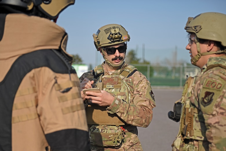 Personnel assigned to the 8th Civil Engineer Squadron Explosive Ordnance Disposal flight prepare to approach the base post office during a training event at Kunsan Air Base, Republic of Korea, April 8, 2020. The training event focused on emergency procedures and response actions in regards to a simulated improvised explosive device placed at the post office. (U.S. Air Force photo by Staff Sgt. Mackenzie Mendez)