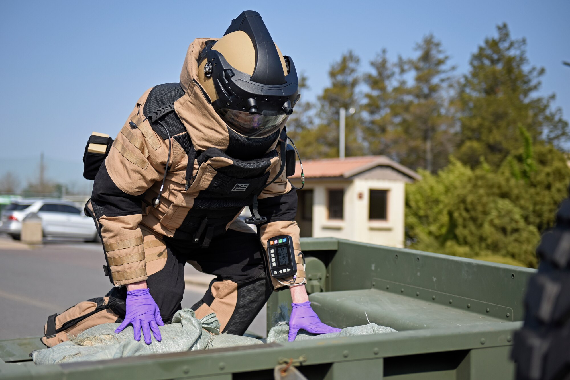 Staff Sgt. Tyler McMillan Wammack, 8th Civil Engineer Squadron Explosive Ordnance Disposal technician, places the simulated improvised explosive device in a trailer for disposal during a training event at Kunsan Air Base, Republic of Korea, April 8, 2020. The training event focused on emergency procedures and response actions in regards to a simulated improvised explosive device placed at the base post office. (U.S. Air Force photo by Staff Sgt. Mackenzie Mendez)