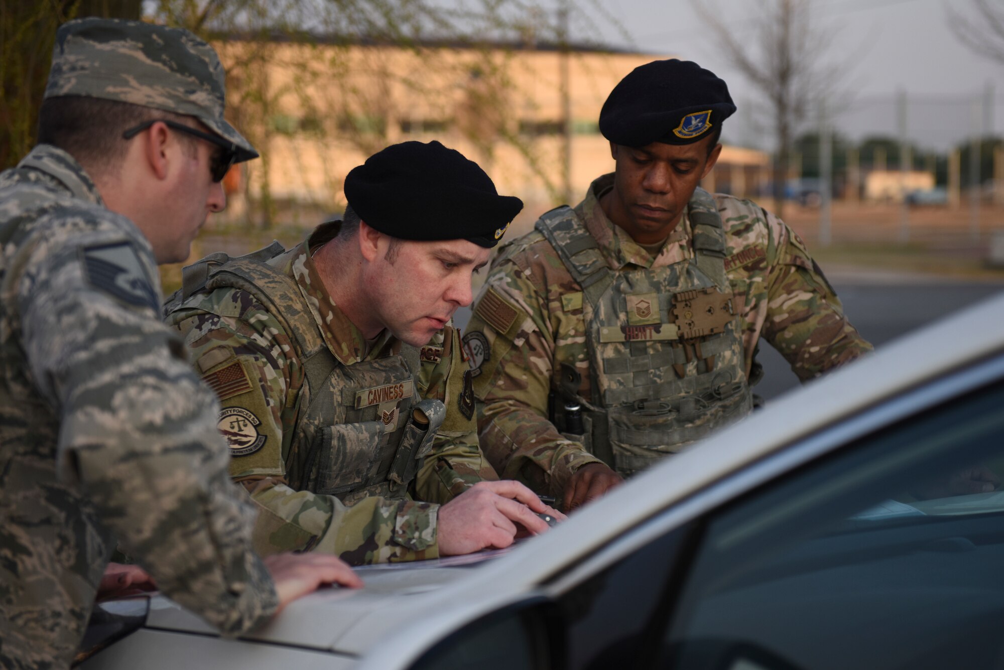 Wolf Pack first responders assigned to the 8th Security Forces Squadron and 8th Civil Engineer Squadron simulate establishing a cordon surrounding the base post office during a training event at Kunsan Air Base, Republic of Korea, April 8, 2020. The training event focused on emergency procedures and response actions in regards to a simulated improvised explosive device placed at the post office. (U.S. Air Force photo by Staff Sgt. Mackenzie Mendez)