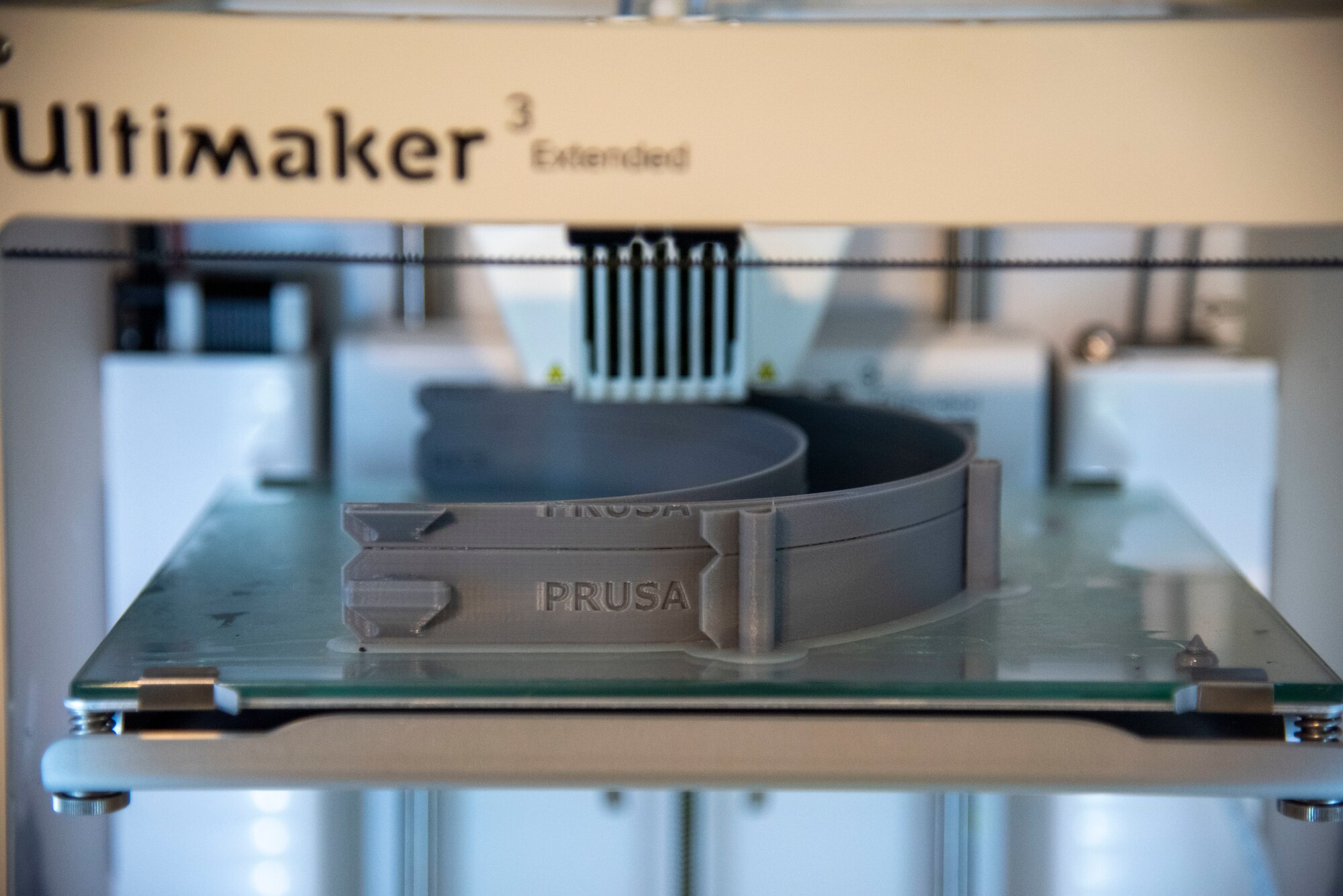 A 3D printer creates face shield adjustable headbands on April 7, 2020 at Dover Air Force Bace, Delaware. The face shields were printed by the 436th Airlift Wing Innovation Lab "Bedrock" for use by medical and security forces personnel supporting COVID-19 response efforts. (U.S. Air Force photo by Airman 1st Class Jonathan Harding)