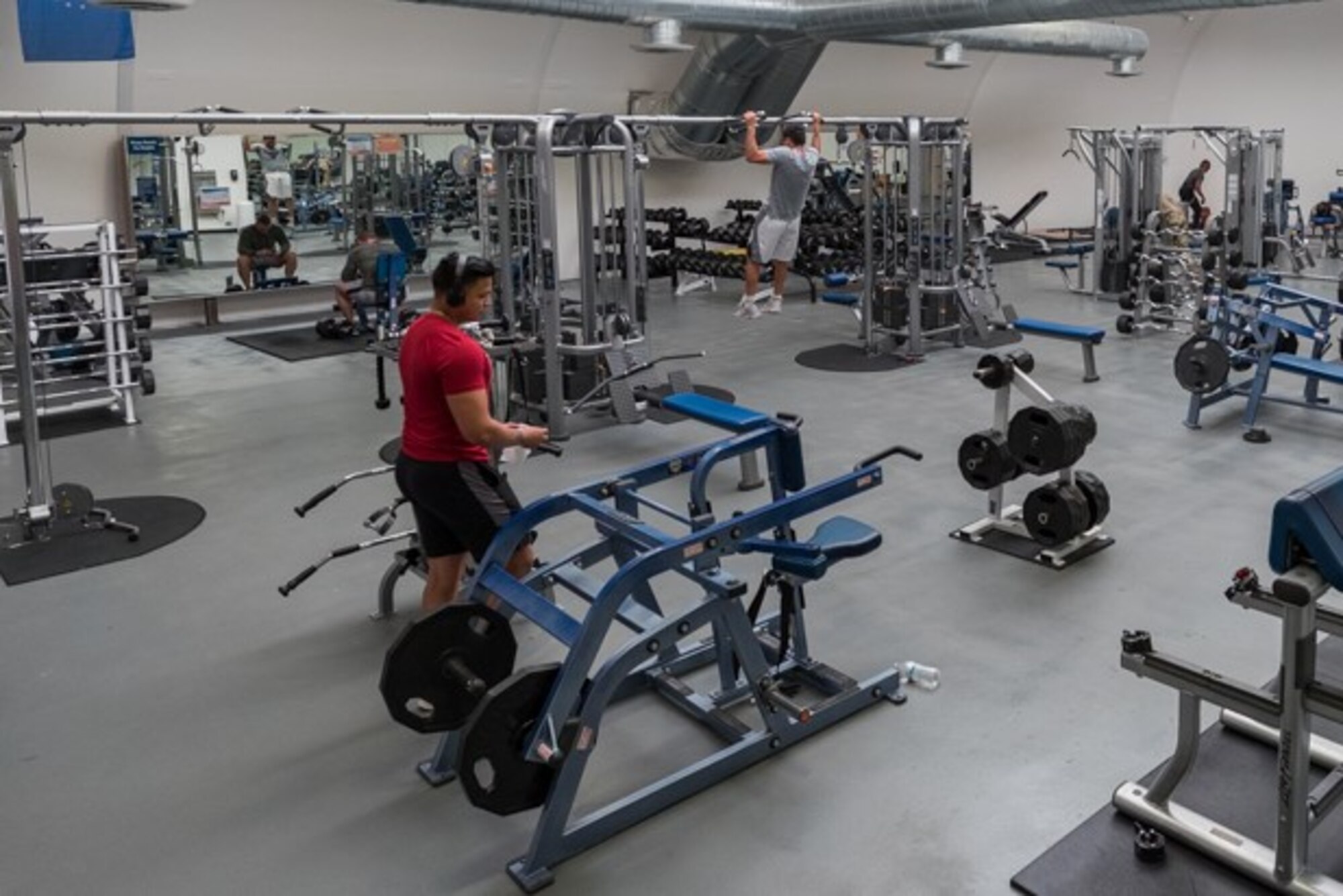 Airmen from Edwards Air Force Base, California, work out at the base gymnasium, maintaining appropriate physical distance, April 7.