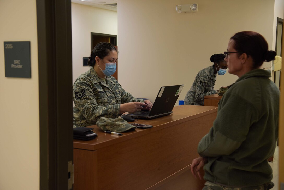 Tech. Sgt. Adriana Dunaway, 514th Force Support Squadron, personnel support for contingency operations, assists a service member on deployment readiness process at Joint Base McGuire-Dix-Lakehurst, N.J., April 5, 2020. Guard and Reserve service members will depart to New York City in support of the DoD response to combat the spread of COVID-19. U.S. Northern Command, through U.S. Army North, is providing military support to the Federal Emergency Management Agency to help communities in need. (U.S. Air Force photo by Airman 1st Class Briana Cespedes)