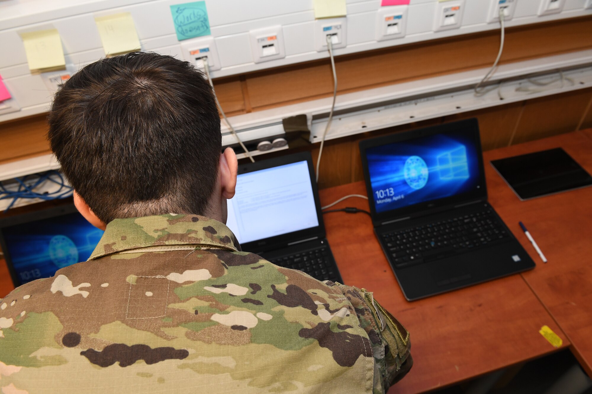 U.S. Air Force Airman 1st Class Wesley Carrow, 52nd Communications Squadron client systems technician, completes a diagnostics check on a laptop at Spangdahlem Air Base, Germany, April 6, 2020. The 52nd CS had a major increase in workflow due to COVID-19, which resulted in hosting a walk in computer diagnostics clinic to assess computer issues across the 52nd Fighter Wing. (U.S. Air Force photo by Airman 1st Class Alison Stewart)