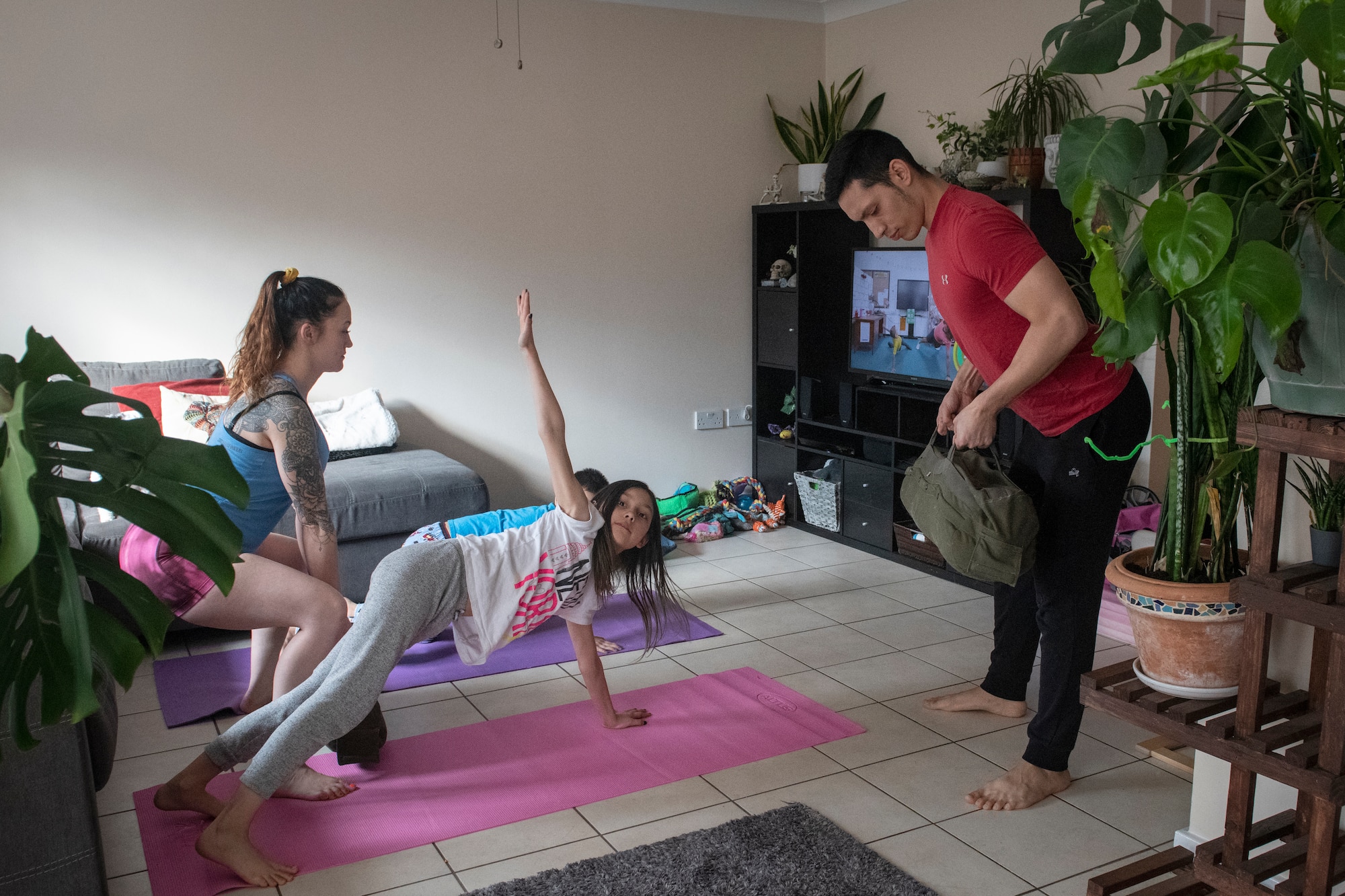 The Nuñez family works out together while being quarantined for two weeks at their home during the COVID-19 outbreak, April 2, 2020. Total force fitness can play an important role in resilience during stressful situations like the COVID-19 outbreak. (U.S. Air Force photo by Tech. Sgt. Emerson Nuñez)