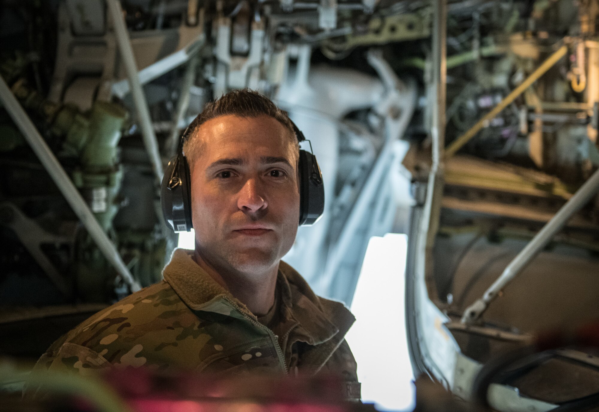 Senior Master Sgt. Brandon Whittom, crew chief, 932nd Maintenance Squadron, performs a physical preflight inspection March, 20, 2020 Scott Air Force Base Illinois as the 932nd Airlift Wing and 73rd Airlift Squadron continue training operations during COVID-19.  Pilots are required to maintain readiness and the 932nd MXS is working hard with reduced manning in support of continued missions. The 932nd Airlift Wing is the only Air Force Reserve Command unit that flies the C-40C, which is used to provide world-class airlift for U.S. national and military leaders.(U.S. Air Force photo by Christopher Parr)