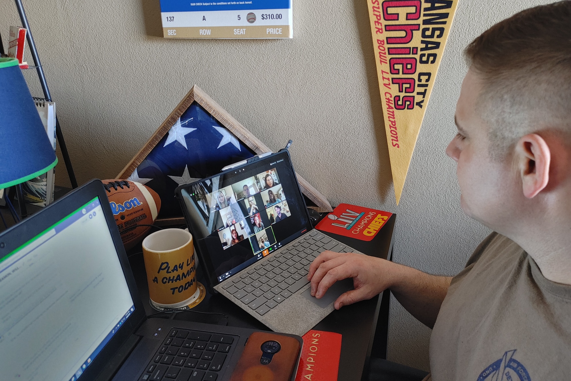 U.S. Air Force Maj. James Thompson, 763rd Specialized Contracting Squadron deputy director, hosts a video teleconference with team mates to talk through recent COVID-19 emergency support to Air Mobility Command.