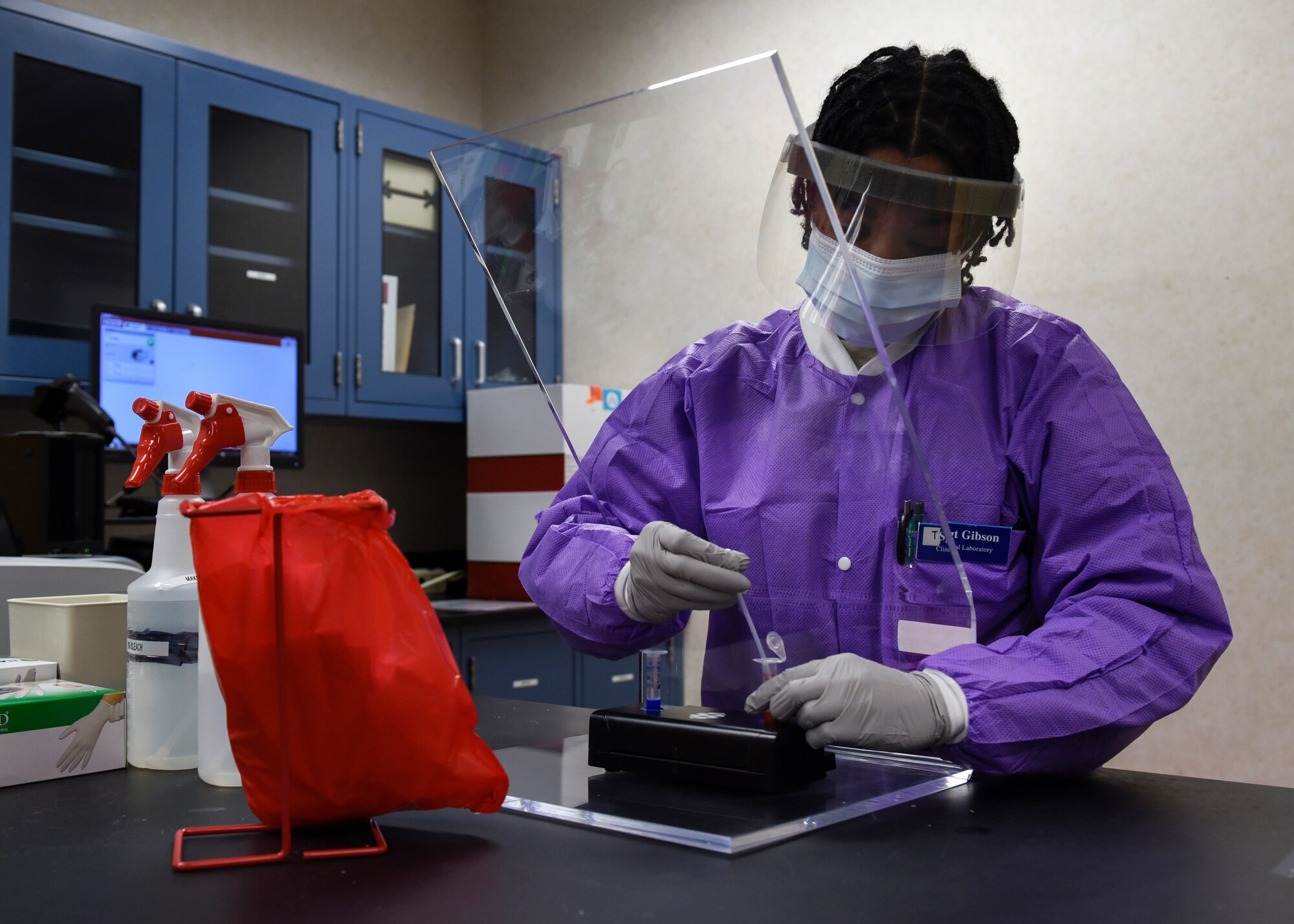 U.S. Air Force Tech. Sgt. Jonisha Gibson, 82nd Medical Group clinical laboratory noncommissioned officer in charge, prepares a sample for testing at Sheppard Air Force Base, Texas, April 9, 2020. Gibson will inject the patient’s sample into a FilmArray pouch that can be analyzed and tested on a molecular level. (U.S. Air Force photo by Senior Airman Pedro Tenorio)