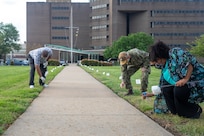 Norfolk Naval Shipyard’s (NNSY) and Suffolk Complex’s Sexual Assault Response Coordinator (SARC) Shalise Bates-Pratt and select individuals continued to observe the yearly tradition of placing small flags along the walkway in front of NNSY’s Norman Sisisky Management and Engineering Building, each flag with handwritten message to victims of sexual assault showing support.