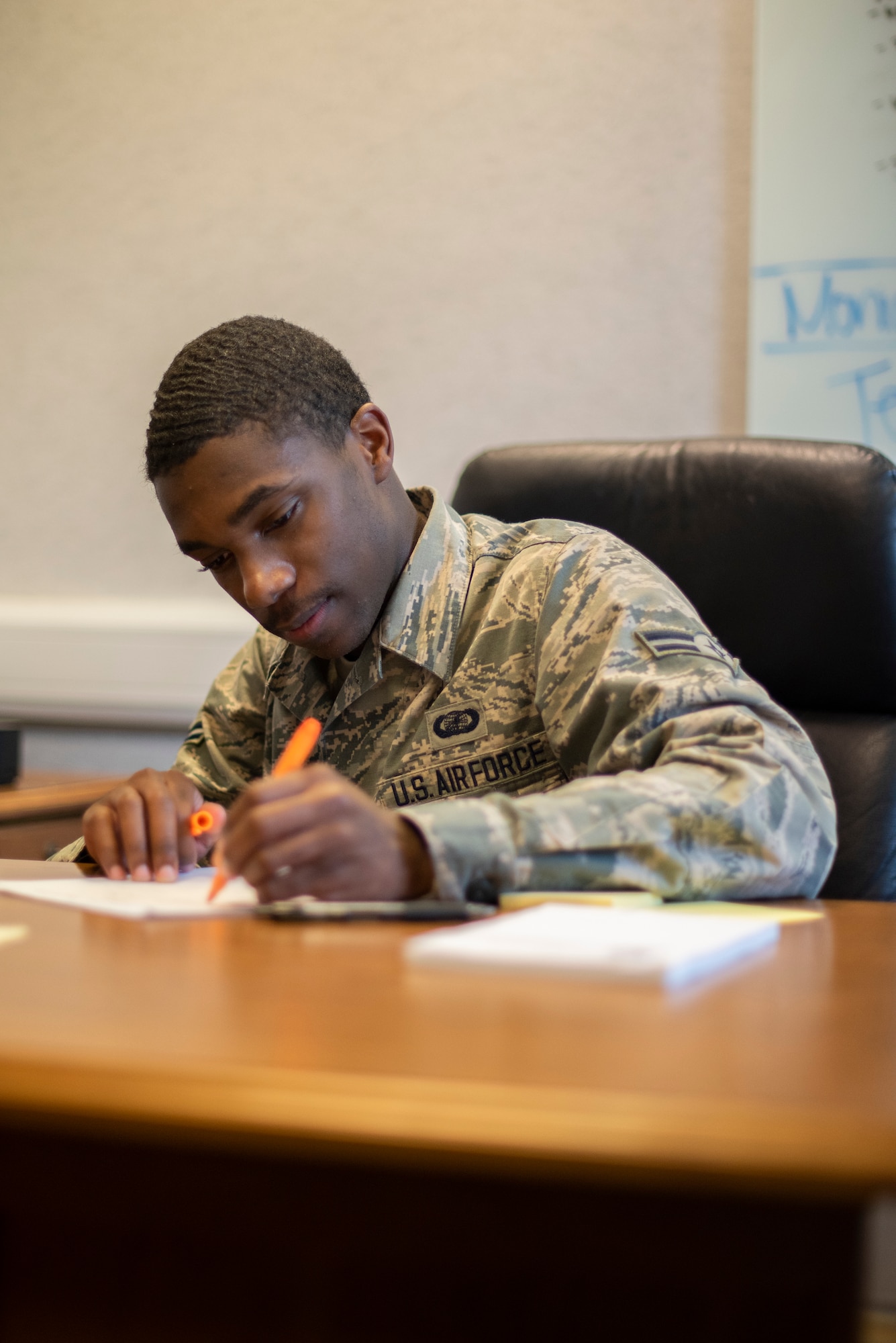 Airman 1st Class Tyran Stokes, 100th Wing Staff Agencies unit control center representative, confirms that accountability of isolated and quarantined Airmen has been completed for all wing staff agencies April 8, 2020, at RAF Mildenhall, England. Unit control centers report information that is routed up multiple levels through the chain of command, so their numbers must be accurate. (U.S. Air Force photo by Airman 1st Class Joseph Barron)