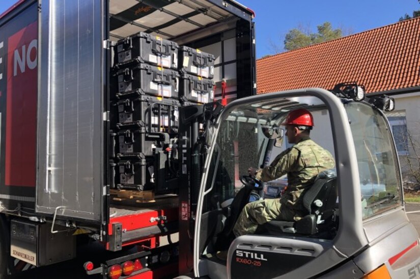 A worker uses a forklift to unload a pallet of medical devices at Landstuhl Regional Medical Center in Germany on March 31.
