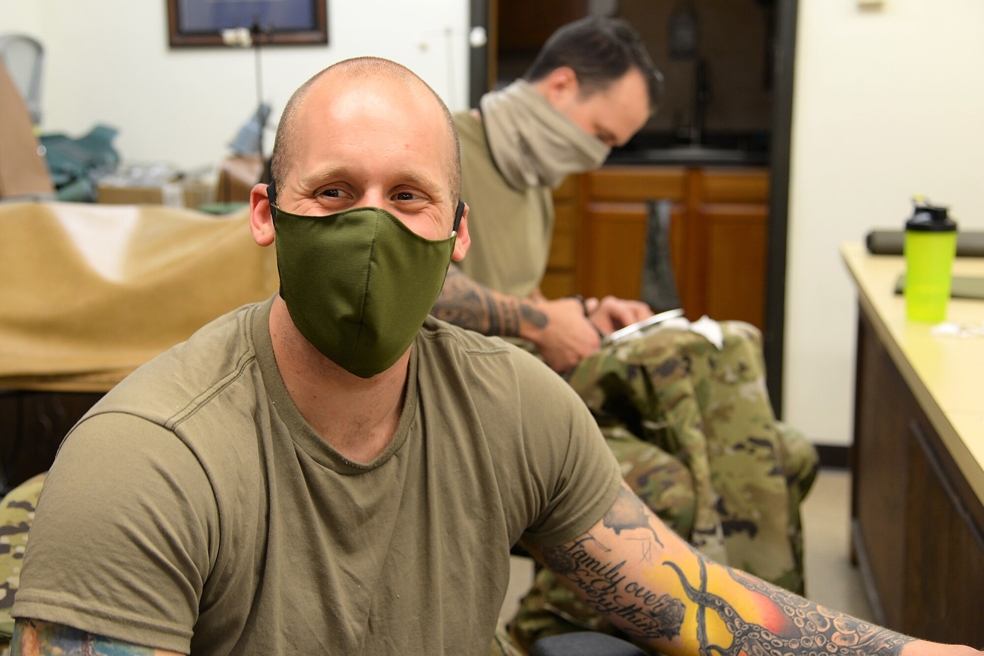 U.S. Air Force Senior Airman Michael R. Ottaviano, 177th Fighter Wing, volunteers to prepare fabric for face masks April 8, 2020, in the Aircrew Flight Equipment shop at the New Jersey Air National Guard Base. The 177th AFE shop is sewing and distributing face masks for mission-essential personnel.