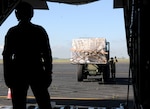 Staff Sgt Adrianne Rigez, left, and Airman 1st Class Casey Rodriguez,  loadmasters with the 129th Rescue Wing, California Air National Guard, load the first pallet of ventilators heading to various states, April 7, 2020, at Mather Airport, Sacramento, California. The state loaned 500 ventilators for treatment of COVID-19 patients in New York, New Jersey, Illinois and Nevada.
