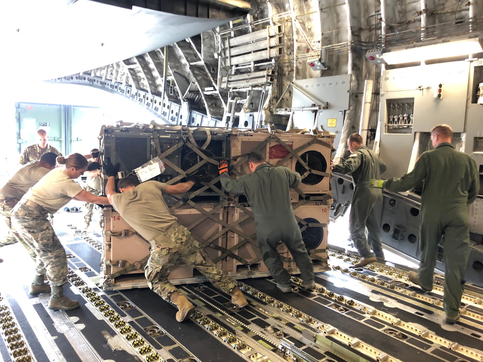 Disaster Relief Bed-Down Sets are loaded on to a C-17 Globemaster III aircraft at the 156th Airlift Wing, Puerto Rico Air National Guard unit, March 24, 2017. The wing flew two C-17’s to Puerto Rico to load and transport two DRBS’s to the 200th RED HORSE Squadron in Mansfield, Ohio. The DRBS’s were deployed to Puerto Rico after an earthquake there in January. (photos courtesy of Capt. Kevin Rudisill)
