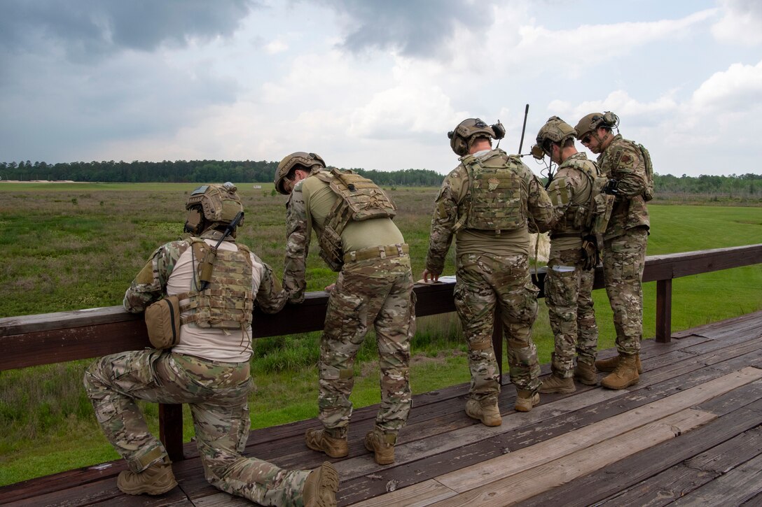 TACP Airmen check their radios