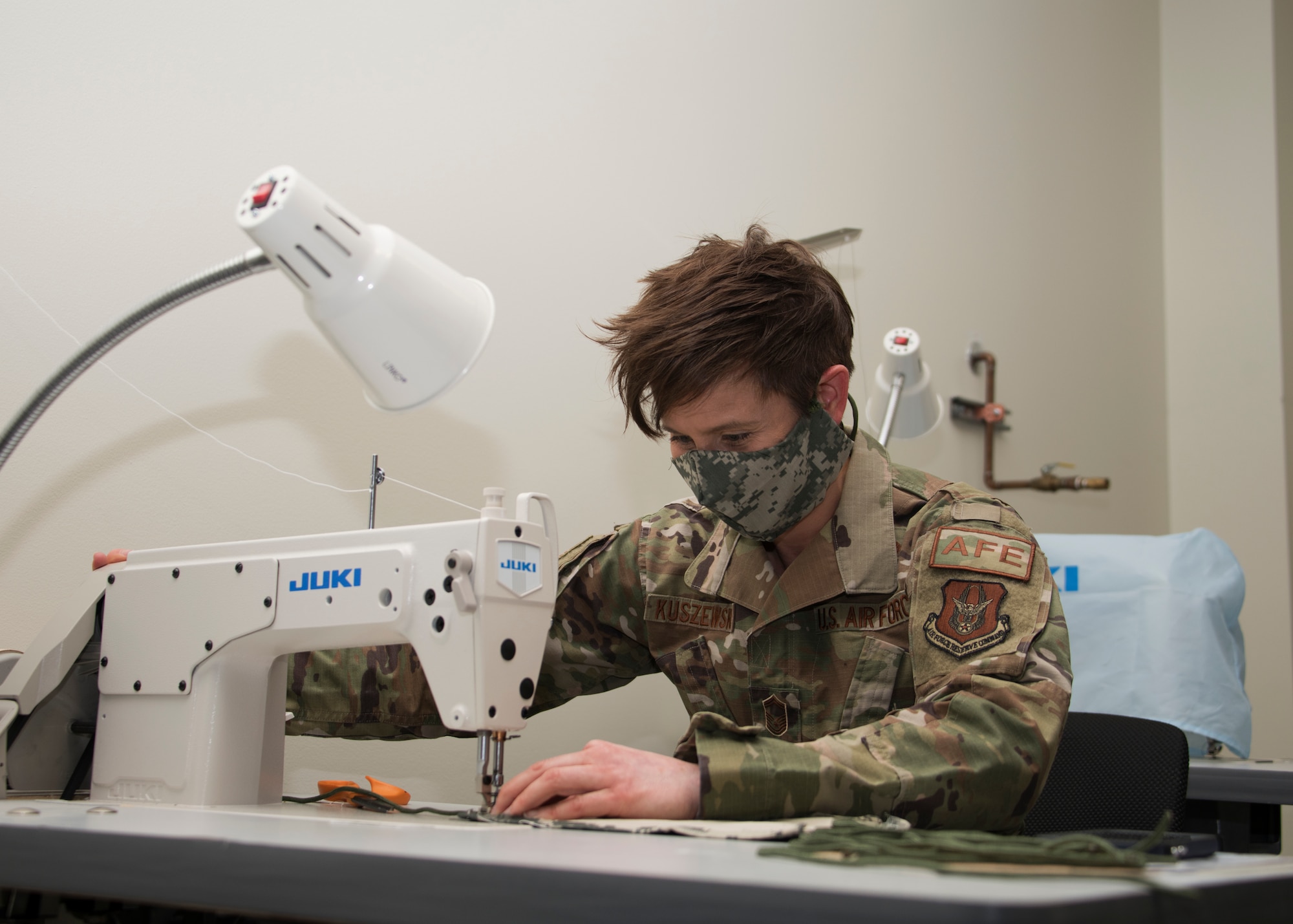 Senior Master Sgt. Megan Kuszewski, 459th Operations Support Squadron, Aircrew Flight Equipment superintendent, sews together a face mask as part of a 1,000 masks project, April 10th, 2020, at Joint Base Andrews, Md. The AFE team volunteers are planning to craft 1,000 Air Force authorized face masks for aircrew members, maintainers and members of the wing. (U.S. Air Force photo/Staff Sgt. Cierra Presentado)