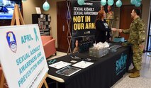 Jennifer Blatter, U.S. Army Space and Missile Defense Command's Sexual Harassment/Assault Response and Prevention program manager, hosts an informational table for Sexual Assault Awareness and Prevention month at the command's Redstone Arsenal, Alabama, headquarters, April 1, 2019. (Photo by Carrie David Campbell)
