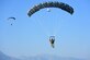 Airmen parachute to their designated landing zone