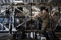 Capt. Naomi King, 628th Operational Medical Readiness Squadron infectious disease team lead, reviews COVID-19 cleaning procedures with Airmen in the Transport Isolation System at Joint Base Charleston, S.C., April 5, 2020.