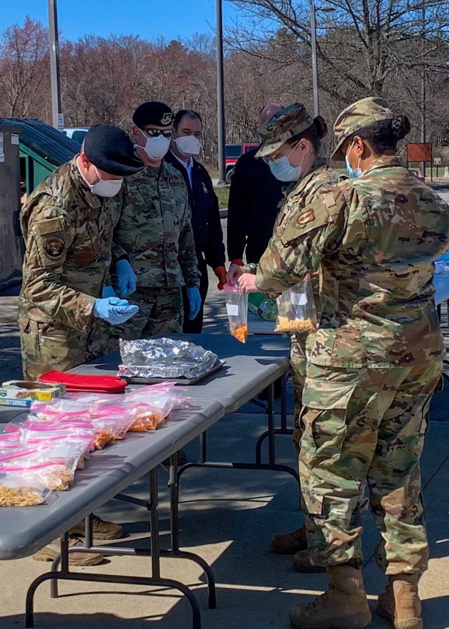 Members of the 66th Security Forces Squadron and 66th Civil Engineering serve lunch to 66th Medical Squadron personnel at Hanscom Air Force Base, Mass., April 6. The luncheon event recognized the hard work members of the 66 MDS have been putting in during COVID-19 response operations. (Courtesy Photo)