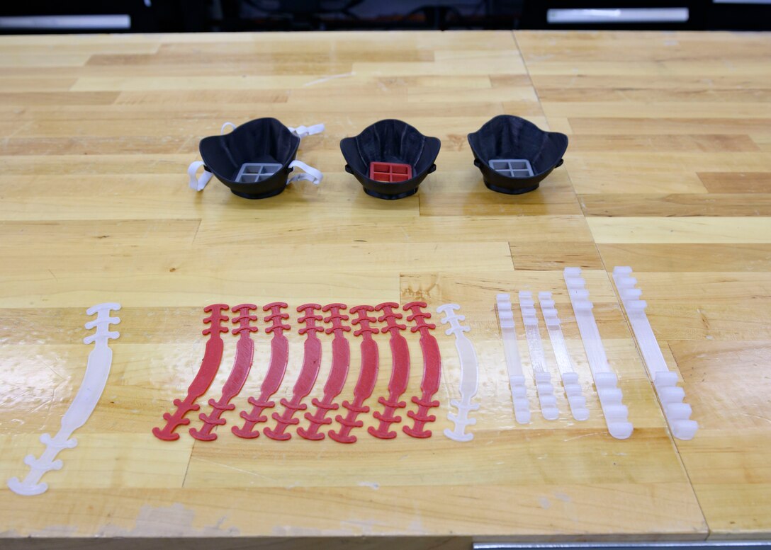 Face masks and Ear Savers designed by the 366th Munitions squadron are showcased on a work table, March 8, 2020, at Mountain Home Air Force Base, Idaho. The masks were made for mission essential personnel to protect them while they continue to perform their duties amid the COVID-19 pandemic. (U.S. Air Force photo by Senior Airman Tyrell Hall)