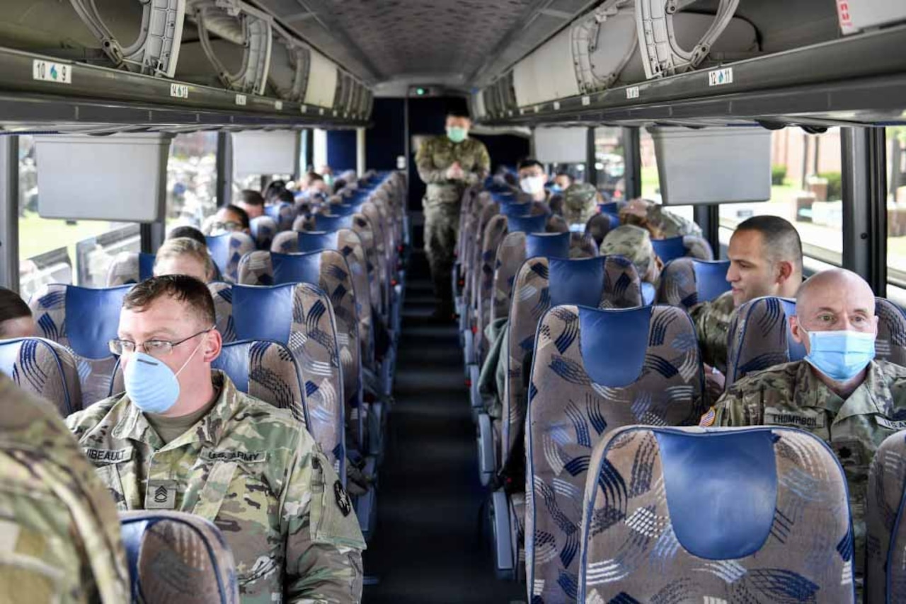 Medical personnel on a bus.