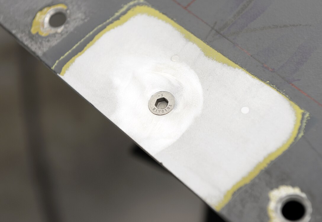 A B-1B Lancer Forward Equipment Bay panel is repaired using cold spray technology.