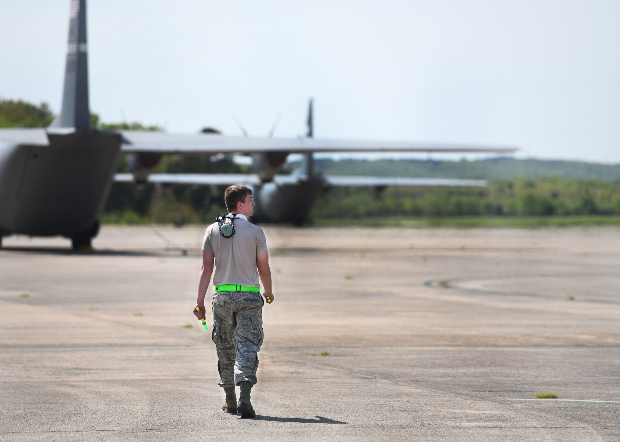 An Airman stands near C-130J Super Hercules