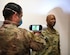 Staff Sgt. Carlos Rodriguez, 11th Wing SparkX innovation technician, scans the face of Chief Master Sgt. Kaleth O. Wright, Chief Master Sgt. of the Air Force, for a 3D model at the SparkX Cell Innovation and Idea Center on JBA, Md., Apr. 10, 2020. Wright’s face was 3D modeled for a custom fit mask, which was printed to show 3D facemask printing capability. All individuals on Department of Defense property, installations and facilities must wear face coverings when they cannot maintain six feet of social distancing. (U.S. Air Force photo by Airman 1st Class Spencer Slocum)