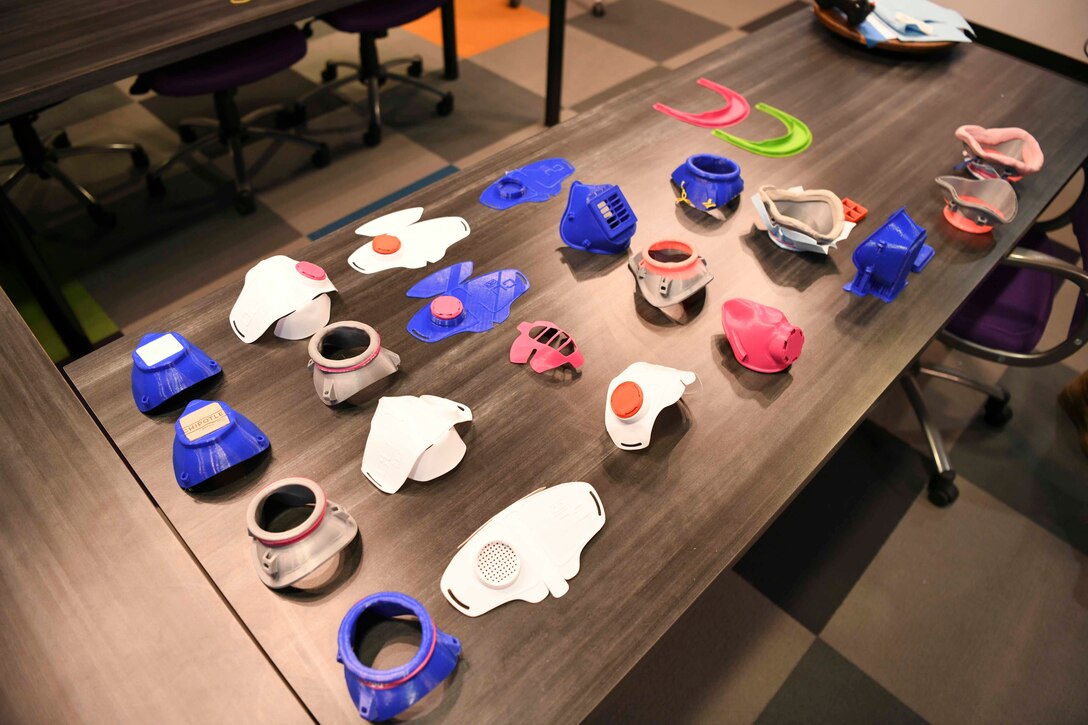 Facemask prototypes rest on a table at the SparkX Cell Innovation and Idea Center on Joint Base Andrews, Md., Apr. 8, 2020. There have been more than five different prototype designs made from multiple different materials. (U.S. Air Force photo by Airman 1st Class Spencer Slocum)