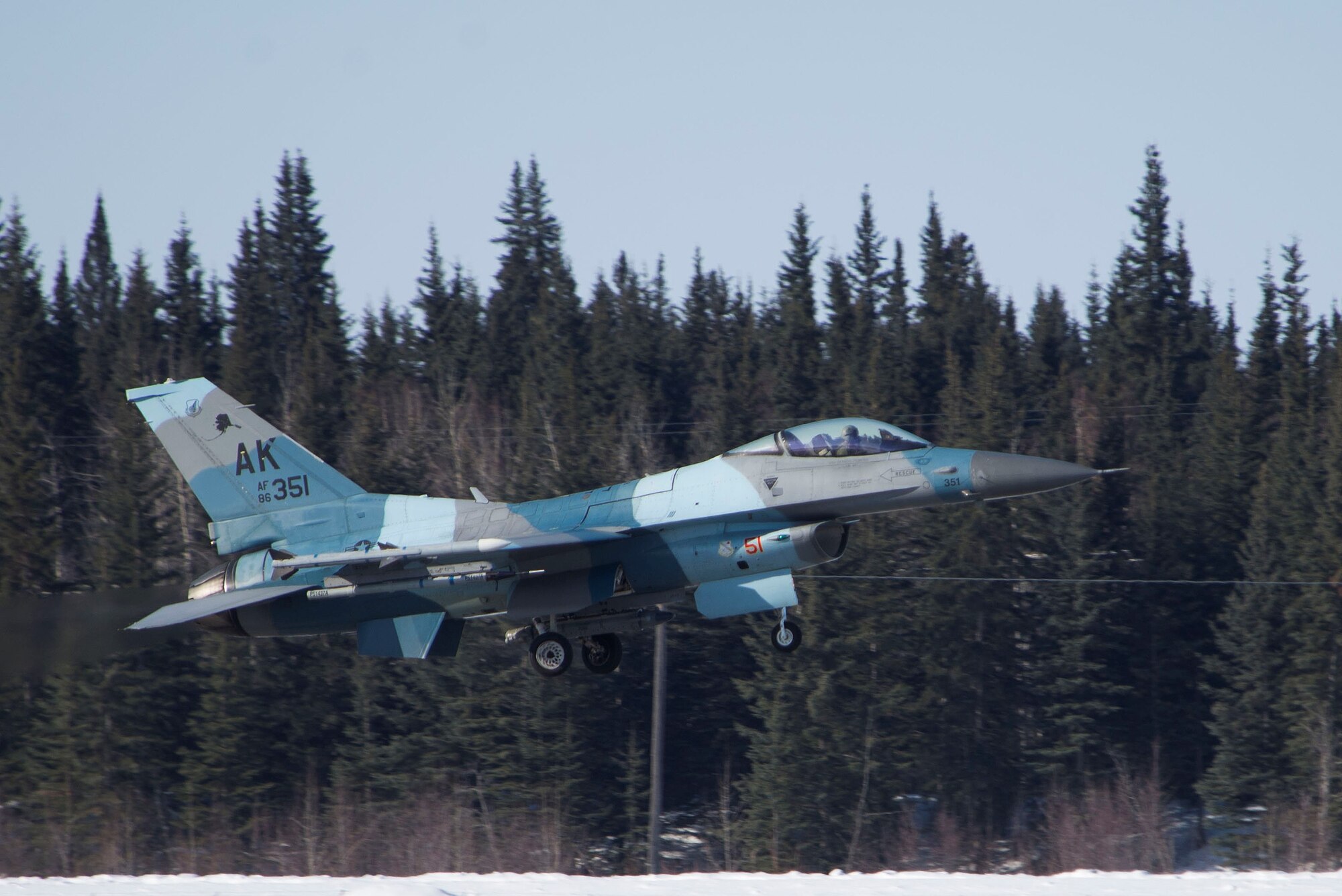 An F-16 Fighting Falcon assigned to the 18th Aggressor Squadron (AGRS) takes off on Eielson Air Force Base, Alaska, April 9, 2020. Pilots assigned to the 18th AGRS met fighter pilots assigned to Joint Base Elmendorf-Richardson, Alaska, in the skies above the Joint Pacific Alaska Range Complex to provide realistic combat training by replicating near-peer adversary capabilities and tactics. (U.S. Air Force photo by Staff Sgt. Zade Vadnais)