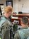 Second Lt. Frank Toohey and 559th Flying Training Squadron instructor pilot Lt. Col. Dan Healey recieve a brief from operations superintendent Lt. Col. John Urso and Jeff Madison of the 12th Operations Support Squadron.