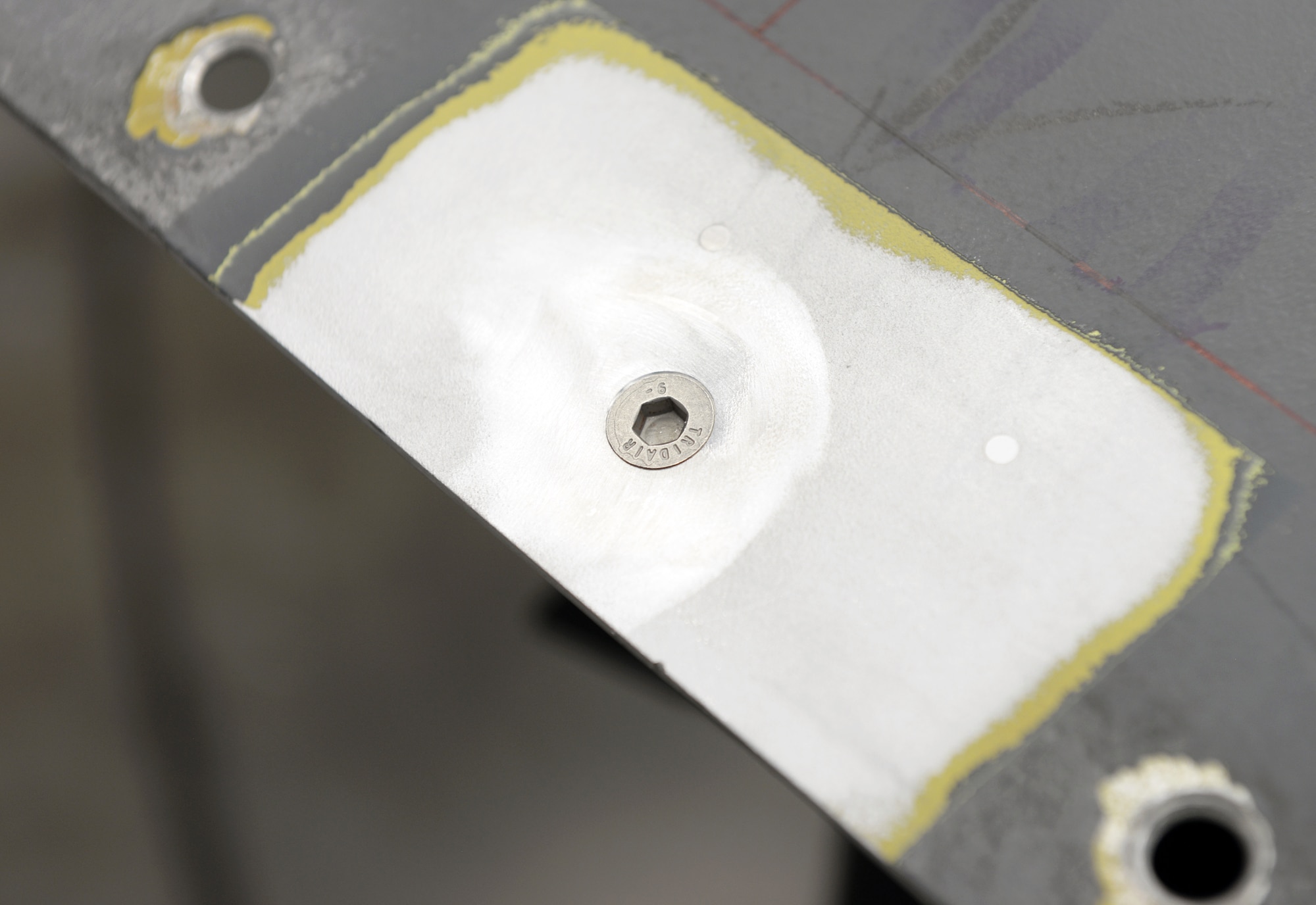 A B-1B Lancer Forward Equipment Bay panel is repaired using cold spray technology.