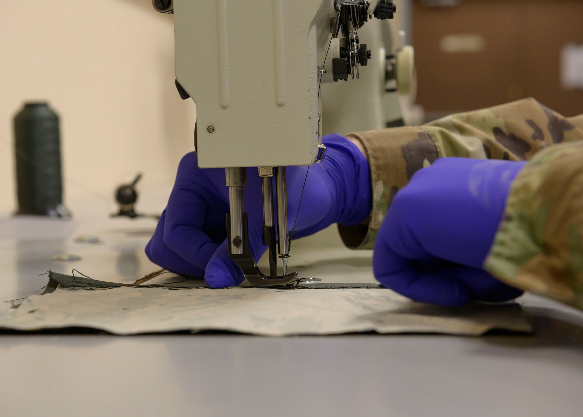 Airmen from the 36th Operations Support Squadron craft cloth masks, March 8, 2020, at Mountain Home Air Force Base. Amid the CVOID-19 pandemic, these masks will serve to prevent the spread of the virus while maintaining social distancing. (U.S. Air Force photo by Senior Airman Tyrell Hall)