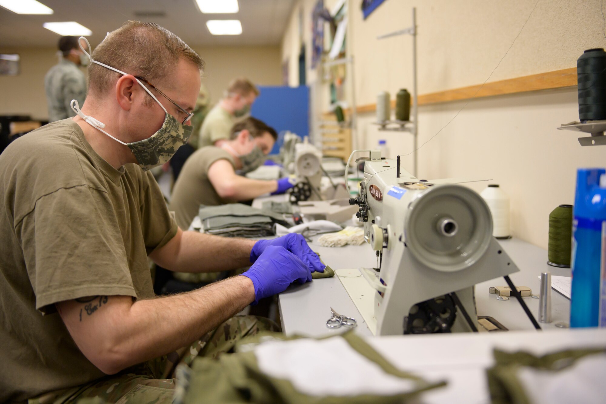 Master Sgt. Douglas Reedy, 366th Operations Support Squadron Aircrew Flight Equipment flight chief, sews cloth masks together, March, 7, 2020, at Mountain Home Air Force Base. All hands were on deck to craft over 500 cloth masks for personnel on base. (U.S. Air Force photo by Senior Airman Tyrell Hall)