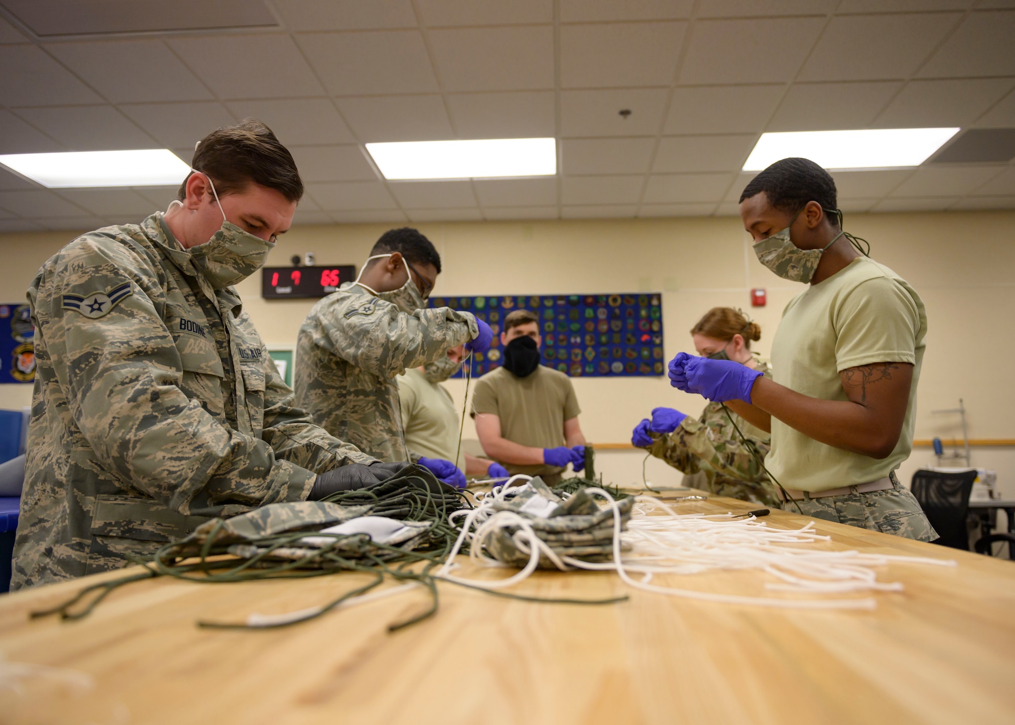 Airmen from the 366th Operations Support Squadron, craft masks for personnel on base, March 20, 2020, at Mountain Home Air Force Base, Idaho. These masks are designed in a multi-layer style to maintain a proper barrier. (U.S. Air Force photo by Senior Airman Tyrell Hall)