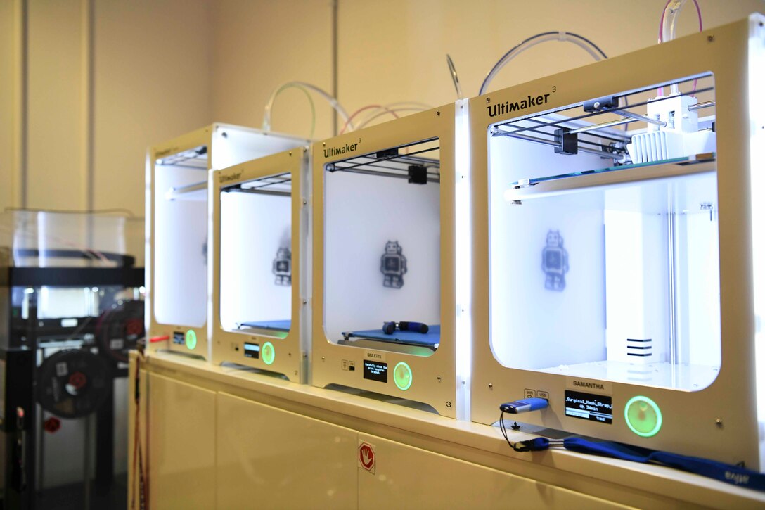 3D printers rest on a table at the SparkX Cell Innovation and Idea Center on Joint Base Andrews, Md., Apr. 8, 2020. Each printer can print up to four facemasks at a time, depending on the model created. Printers can print one facemask in as little as three hours with one hour of post-processing. (U.S. Air Force photo by Airman 1st Class Spencer Slocum)