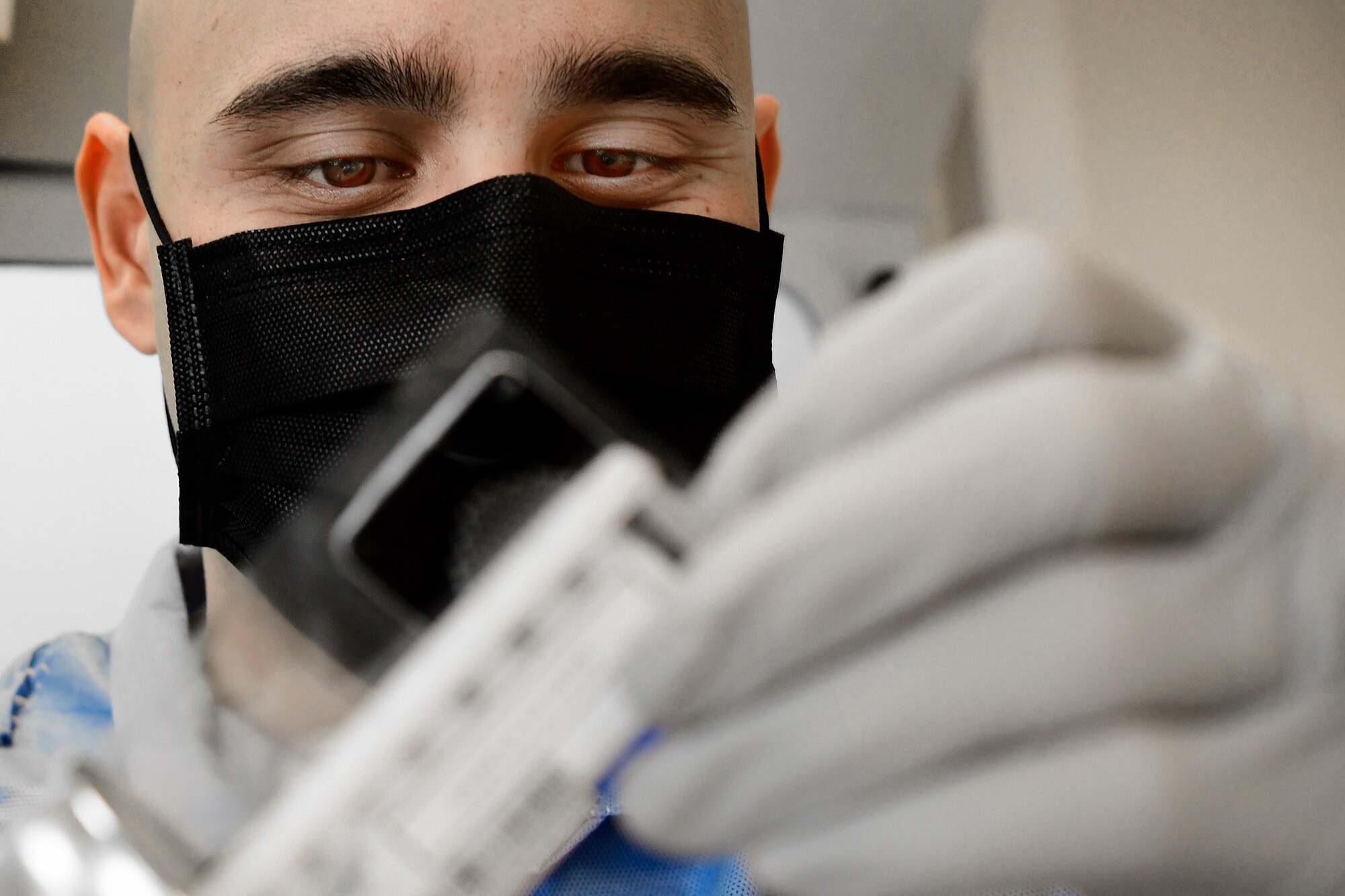 U.S. Air Force Tech. Sgt. Jordan Rigor, 48th Medical Support Squadron, conducts COVID-19 testing at Royal Air Force Feltwell, England, April 9, 2020. The capability to test locally has reduced the wait time for results from 5-7 days to less than 24 hours. (U.S. Air Force photo by Master Sgt. Matthew Plew)