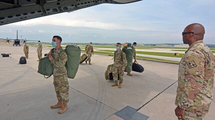 Officer watches Soldiers.