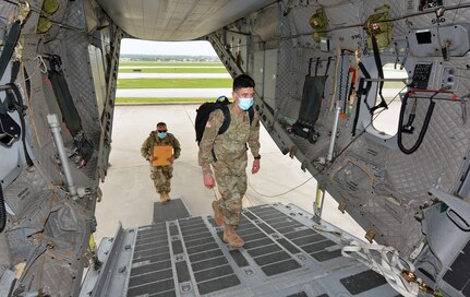 Soldiers board aircraft