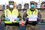 Airmen and Soldiers of the Massachusetts National Guard take a photo as they respond together to help their communities during the COVID-19 pandemic. Security Forces Airmen from the 104th Fighter Wing, Barnes Air National Guard Base, and Soldiers with the 747th Military Police Company, Massachusetts Army National Guard, are providing security for testing sites and shelters for the homeless who may have contracted the coronavirus.