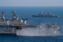 JS Akebono (DD 108) sails with USS America (LHA 6)