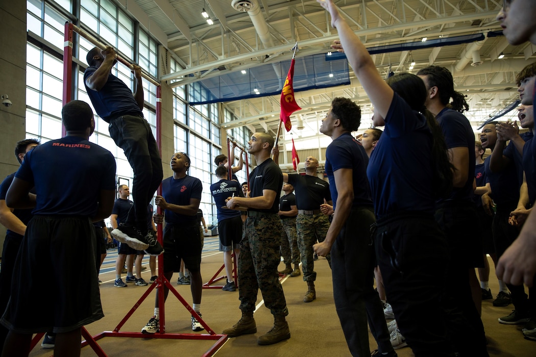 United States Marine Corps recruiters with Recruiting Station Baltimore get their poolees excited during the pull-up competition at the annual Statewide Pool Function at the U.S. Naval Academy in Annapolis, Md., March 7, 2020. The pool function tests young men and women mentally, morally and physically for the rigors of recruit training. (U.S. Marine Corps photo by Cpl. Tojyea Matally/Released)