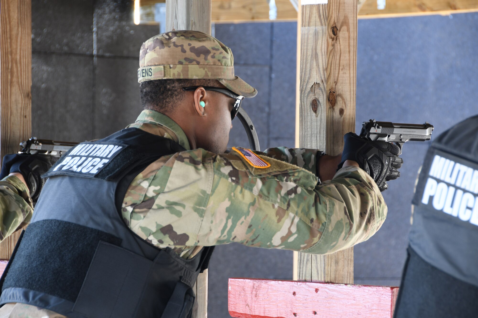 Spc. Michael Stevens, 1-182nd, Bravo Company Infantryman in the Massachusetts National Guard and civilian hospital security guard,  shoots an M9 at the 104th Fighter Wing range. The 104th Fighter Wing Combat Arms Training and Maintenance Instructor ensures the Infantrymen from 1st Battalion, 182nd Infantry Regiment, Bravo Company are currently qualified on the M9 pistol. The Massachusetts National Guard Infantrymen are activated in response to COVID-19 to ensure there is enough manpower available to safeguard the 104th Fighter Wing assets and personnel. These precautions are being taken to mitigate any manning shortages that may occur due to unforeseen illness and will allow back up for the wing’s Security Forces. During the pandemic, the infantrymen will be working alongside the 104th Security Forces to reinforce security for the 104th Fighter Wing F-15 homeland defense flying mission to maintain air superiority.(U.S. Air National Guard Photo by Senior Master Sgt. Julie Avey)