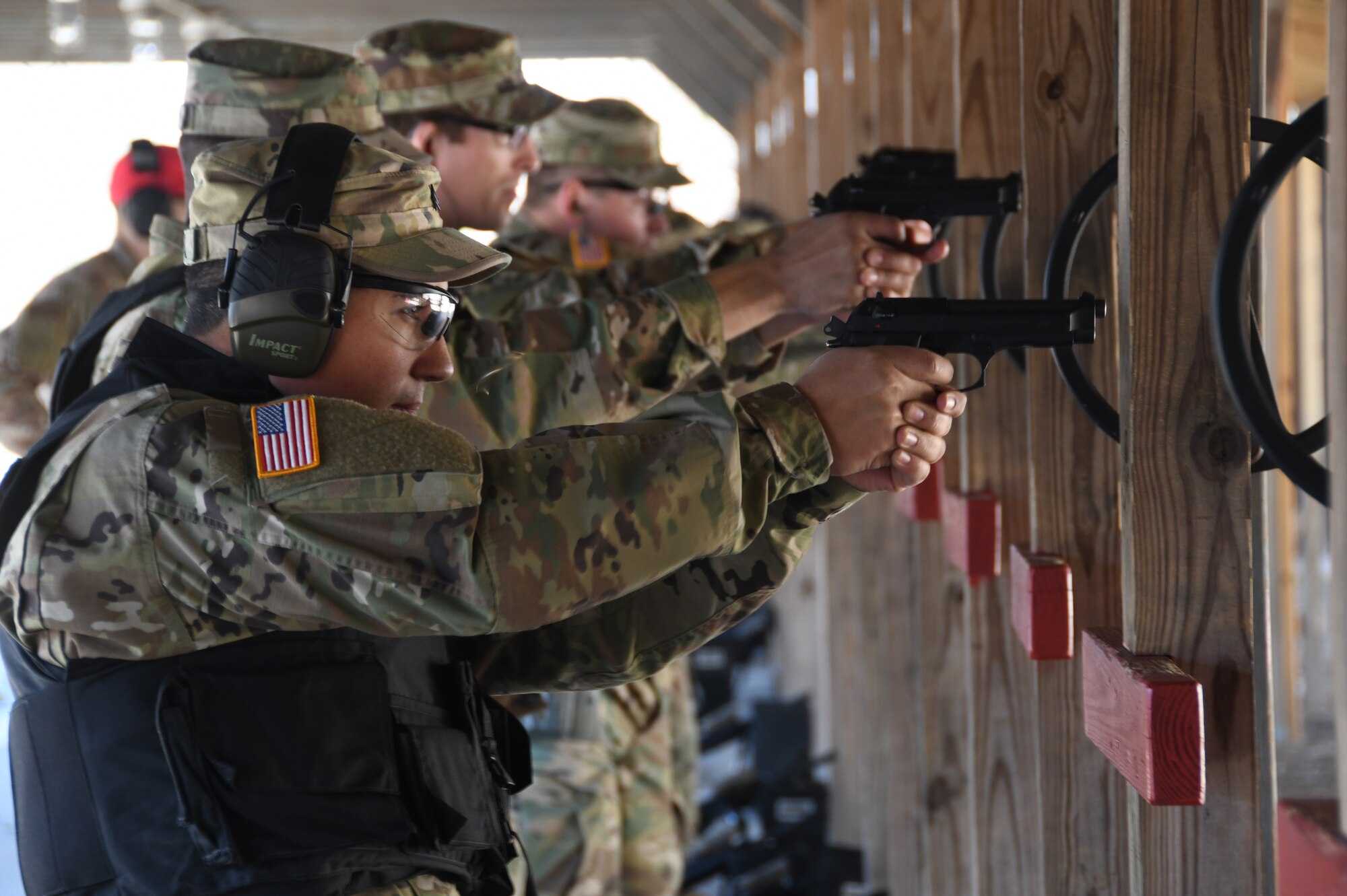 Sgt. Mario Mario Rivera, 1-182nd, Bravo Company Infantryman in the Massachusetts National Guard, shoots an M9 at the 104th Fighter Wing range. The 104th Fighter Wing Combat Arms Training and Maintenance Instructor ensures the Infantrymen from 1st Battalion, 182nd Infantry Regiment, Bravo Company are currently qualified on the M9 pistol. The Massachusetts National Guard Infantrymen are activated in response to COVID-19 to ensure there is enough manpower available to safeguard the 104th Fighter Wing assets and personnel. These precautions are being taken to mitigate any manning shortages that may occur due to unforeseen illness and will allow back up for the wing’s Security Forces. During the pandemic, the infantrymen will be working alongside the 104th Security Forces to reinforce security for the 104th Fighter Wing F-15 homeland defense flying mission to maintain air superiority. (U.S. Air National Guard Photo by Senior Master Sgt. Julie Avey)