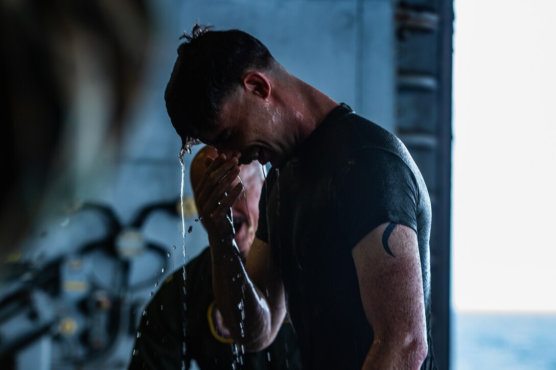 A U.S. Marine stands following his baptism during an Easter service aboard amphibious assault ship USS America (LHA 6), April 12.