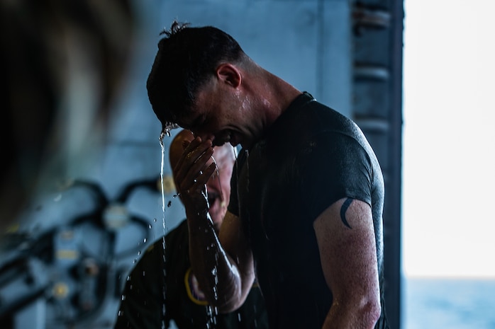 A U.S. Marine stands following his baptism during an Easter service aboard amphibious assault ship USS America (LHA 6), April 12.