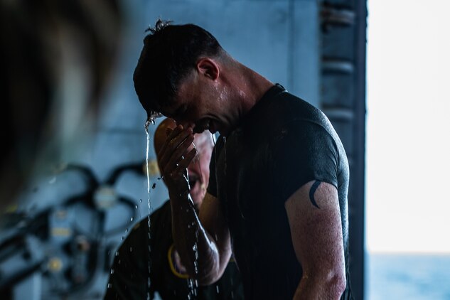 A U.S. Marine stands following his baptism during an Easter service aboard amphibious assault ship USS America (LHA 6), April 12.