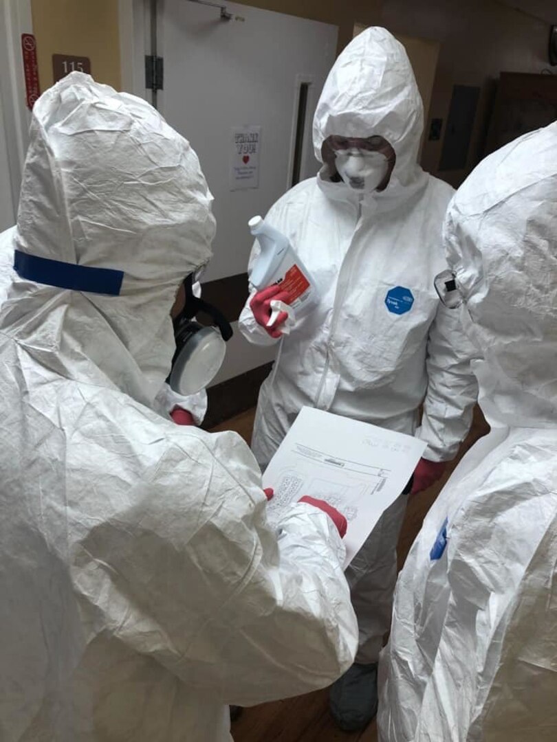 Soldiers of the Atlanta-based Company C, 3rd Battalion 121st Infantry Regiment, Georgia National Guard, assist an infection control team of the Forsyth-based 2-121st who are disinfecting a nursing home in Plains, Georgia.