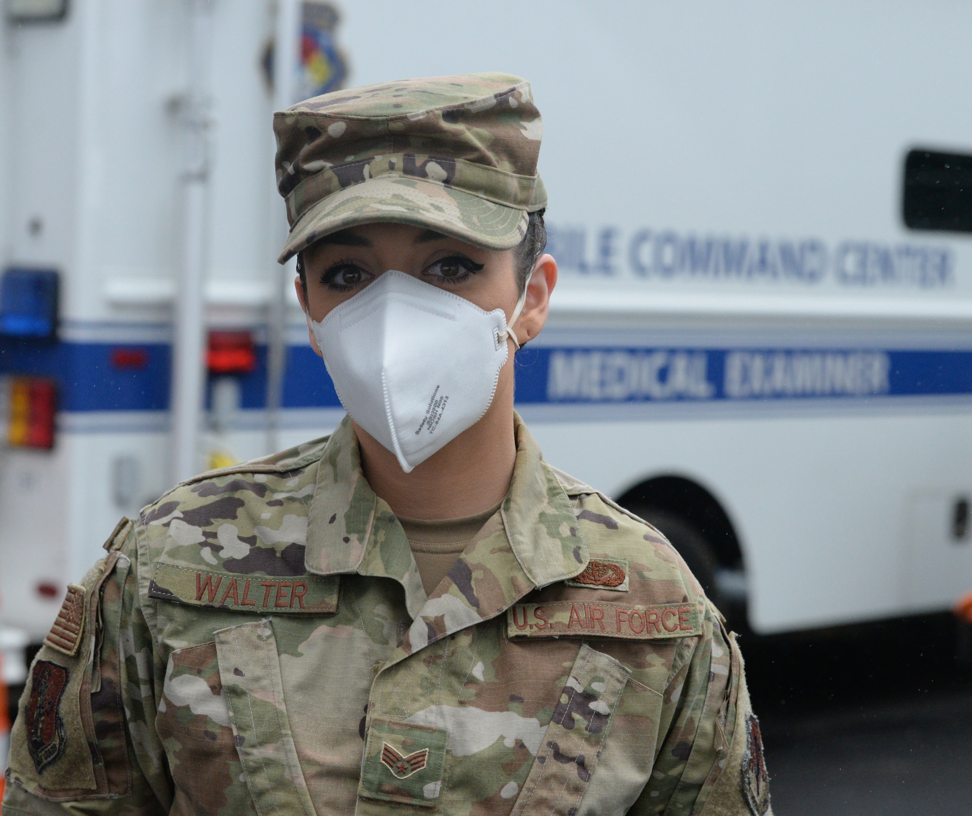 Senior Airman Anita Walter from North Tonawanda, N.Y., assigned to the Fatality Search and Recovery Team of the  New York Air National Guard's 107th Attack Wing, poses for a photo outside Bellevue Hospital in New York City, April 4, 2020. The Airmen are trained in the dignified recovery of human remains during disasters and are supporting the Office of the Chief Medical Examiner of New York City  as part of New York's response to the COVID-19 pandemic.  (U.S. Air National Guard photo by Senior Airman Sean Madden)